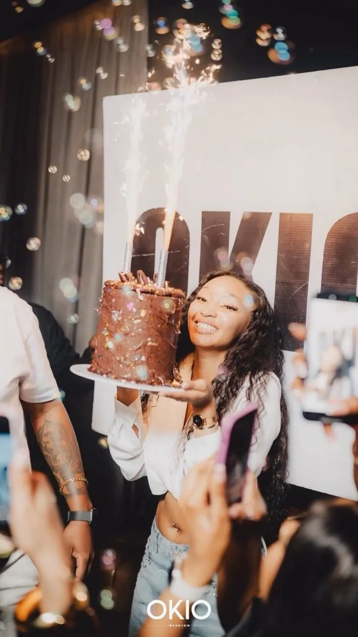 Birthday cake with sparklers carried through the crowd at OKIO